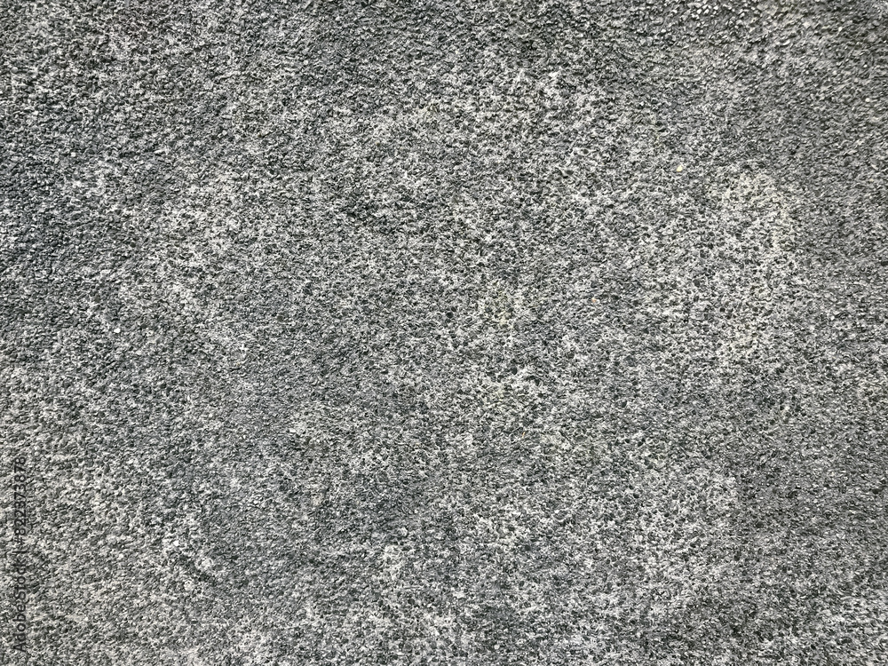 A grey and white background with a few small black dots A grey and white background with a few small black dots
