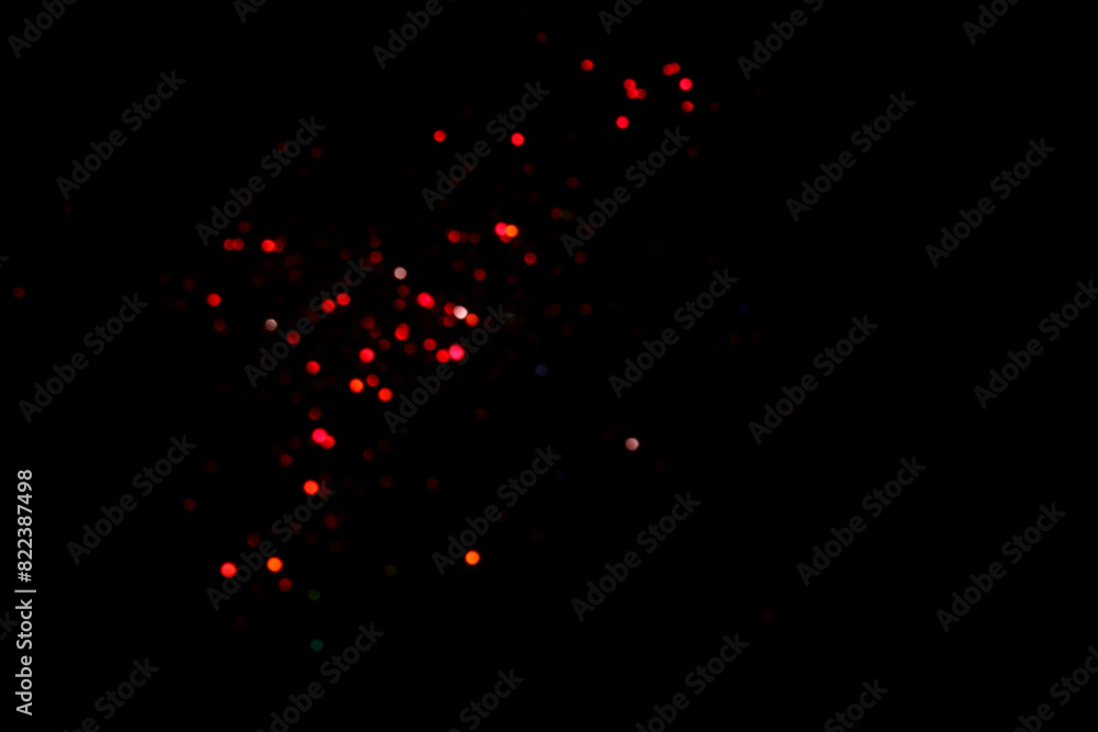 Red blurred bokeh lights on black background. Glitter sparkle confetti for celebrate. Overlay for your design Red blurred bokeh lights on black background. Glitter sparkle confetti for celebrate. Overlay for your design