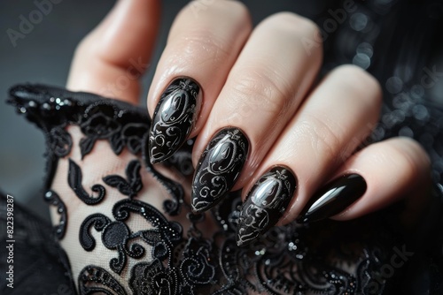 Hand Model With Long Almond Shaped Nails Painted In Black With A Gothic Style