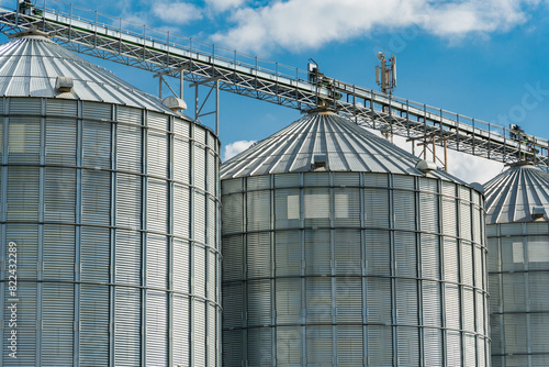 Modern steel agricultural grain granary silos. Agricultural warehouse. Agro industry