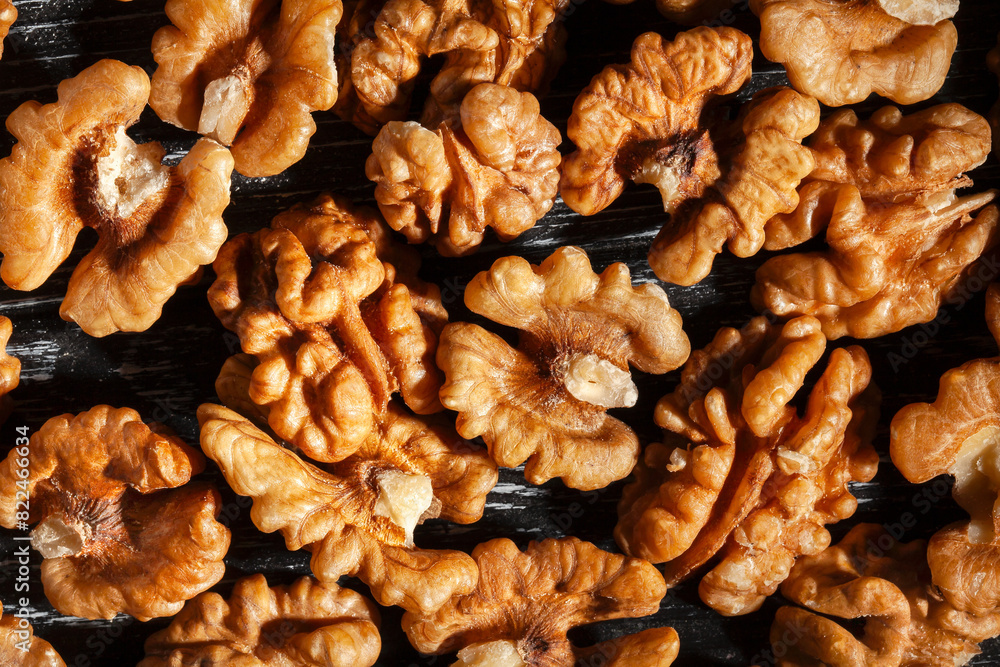 walnuts on black wood background top view walnuts on black wood background top view