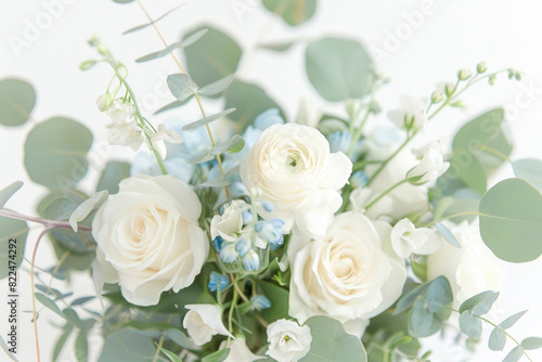 Small bouquet with white and light blue flowers on white background