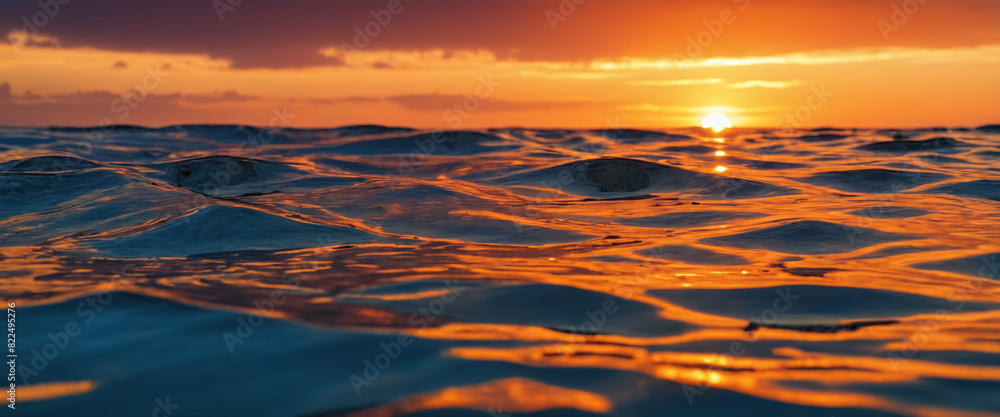 Fototapeta premium Colorful sunset with ocean waves and clouds