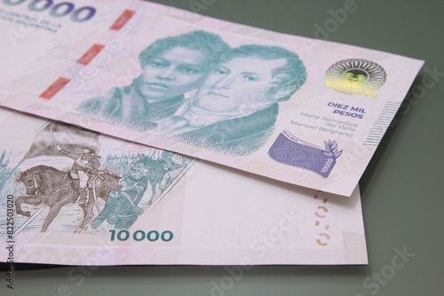 Argentine Money - Currency of Argentine, Pesos argentinos. Ten thousand pesos bill, ten thousand pesos cash bills on dark background.