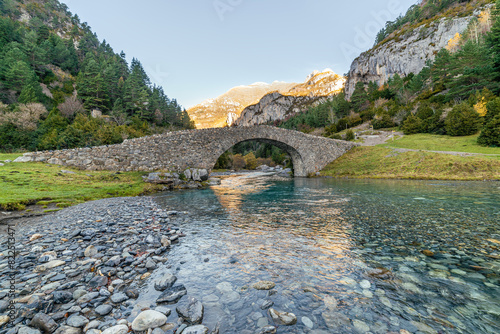 The Bujaruelo Bridge is a 13th century Romanesque bridge over the Ara River, in the province of Huesca, in the Aragonese Pyrenees. photo