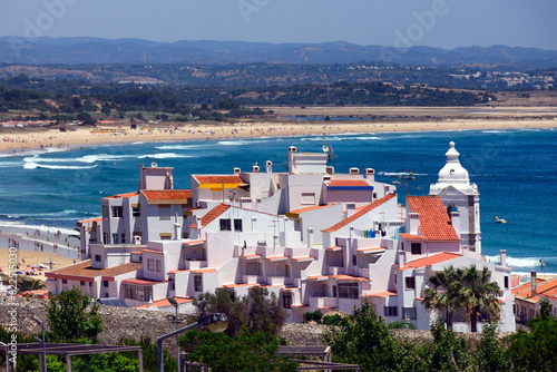 Lagos, Faro district, Algarve, Portugal, Europe - in front Biossdaudavel park, city walls, tower of Santo Antonio church and old town, background long sandy Meia Praia beach and Monchique mountains 