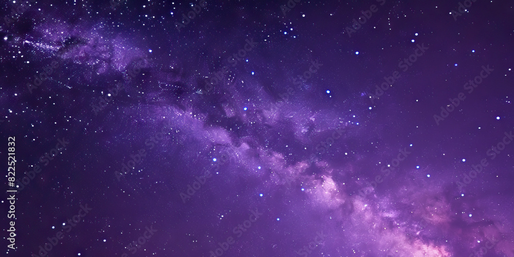 Obraz premium The deep purple night sky is filled with twinkling stars, the Milky Way stretching across it like a shimmering ribbon
