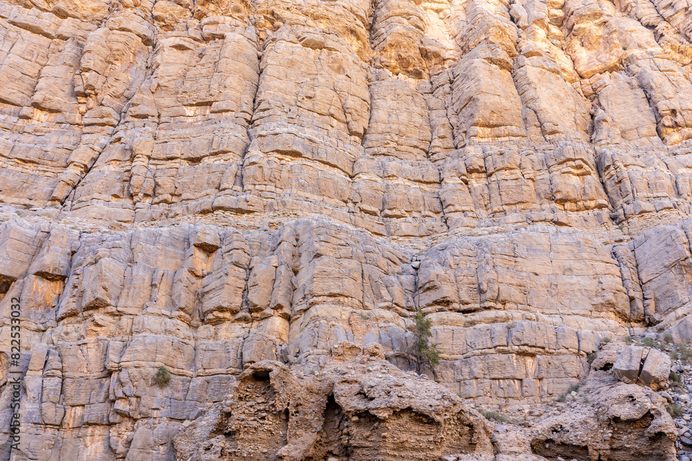 Limestone vertical cliff in Jebel Jais mountain range, Hajar Mountains, United Arab Emirates. Limestone vertical cliff in Jebel Jais mountain range, Hajar Mountains, United Arab Emirates.