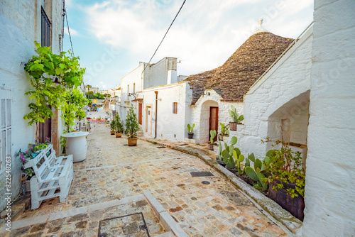 Trulli of Alberobello, Puglia, Italy. town of Alberobello with trulli houses among green plants and flowers