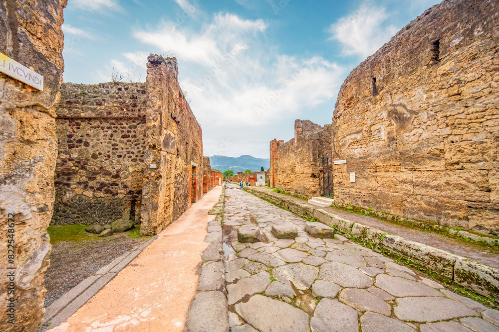 Ruins of Pompeii near Naples, Italy. Pompeii is an ancient Roman city. Mount Vesuvius. Panorama of abandoned street in Pompei.