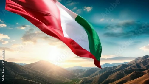 An Italian flag waves majestically against a scenic mountain backdrop at sunset, symbolizing patriotism. Concepts include heritage, pride, landscape, nature photo