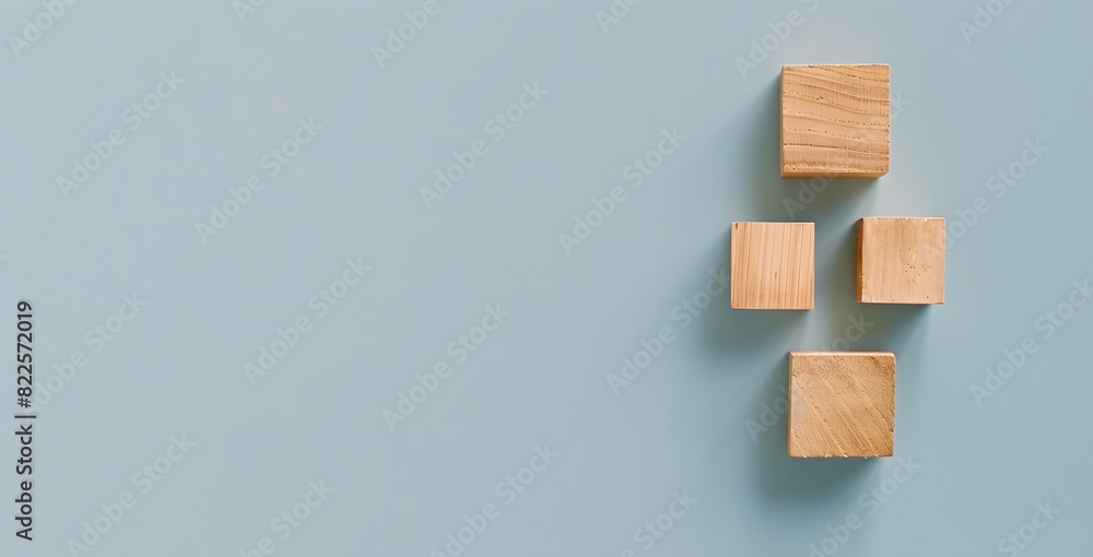 Minimalistic Wooden Blocks on Light Blue Background Minimalistic Wooden Blocks on Light Blue Background