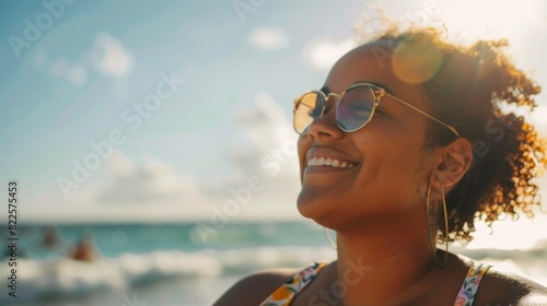 A woman enjoying a day at the beach embracing her femininity and body positivity in a . photo