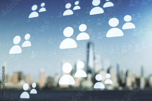 Double exposure of abstract virtual social network icons on blurry cityscape background. Marketing and promotion concept