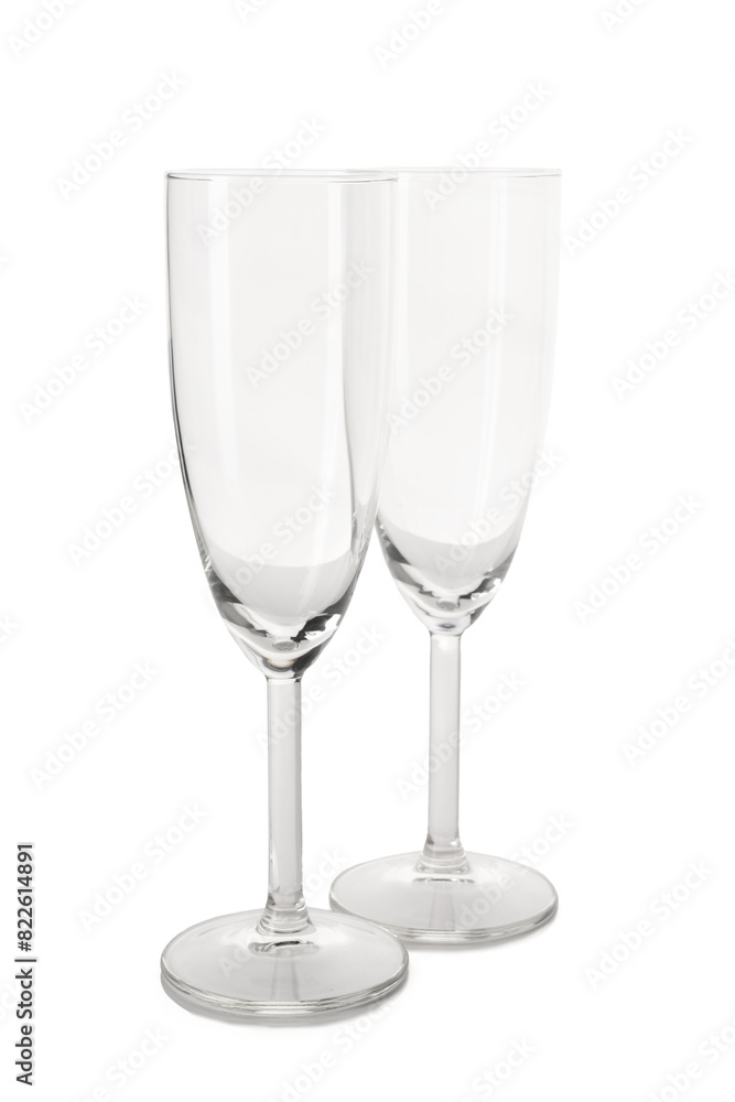 Beautiful champagne glasses on white background