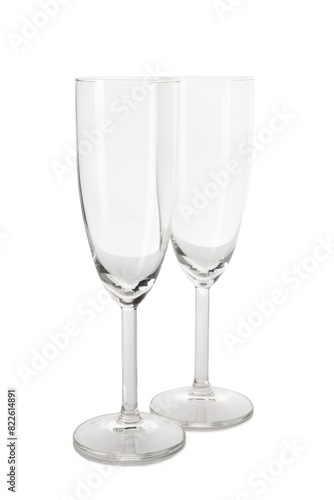 Beautiful champagne glasses on white background