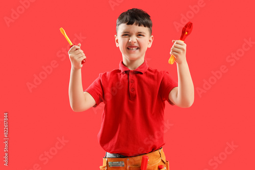 Angry little builder with t...