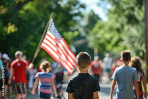 A boy is holding a flag in a parade