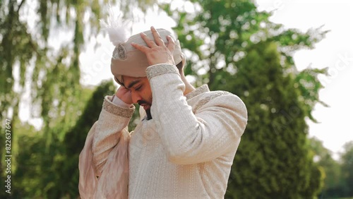 Inside the Indian wedding, the bridegroom brides together and worships the Lord. Happy indian groom handsome portrait