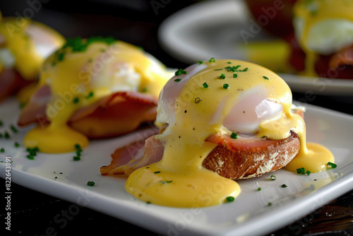 Classic Eggs Benedict with Ham, Poached Eggs, and Hollandaise Sauce