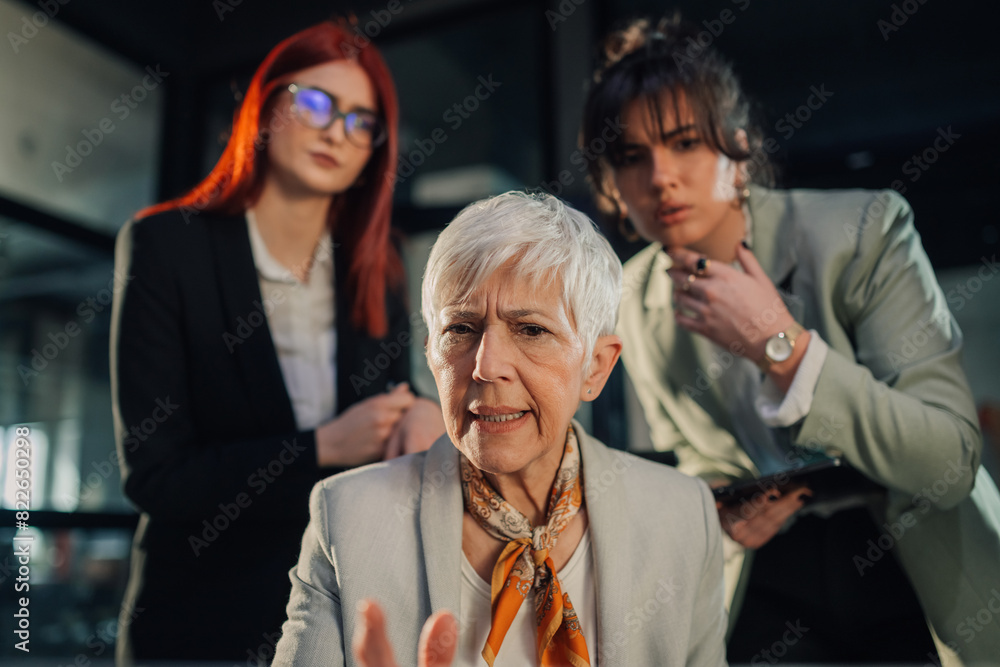 Angry senior female manager criticize her junior team for bad business Angry senior female manager criticize her junior team for bad business