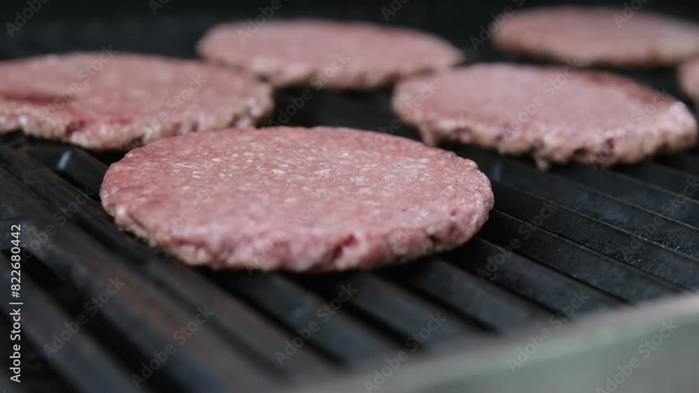 Meat burgers or cutlet-shaped patty being shallow fried in oil on frying pan, close up. Russian or Polish version of cutlets - kotlety. Home cooking toasting minced meat. Meat burgers or cutlet-shaped patty being shallow fried in oil on frying pan, close up. Russian or Polish version of cutlets - kotlety. Home cooking toasting minced meat.