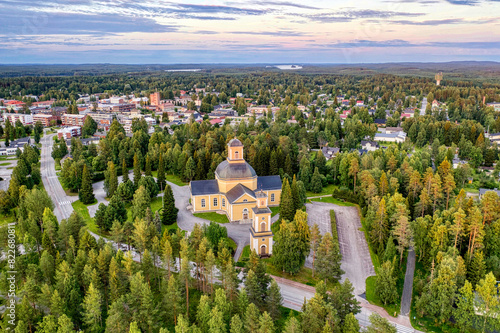 Finland, Kainuu. Aerial view of Evangelical Lutheran church and the city of Kuhmo at dusk photo