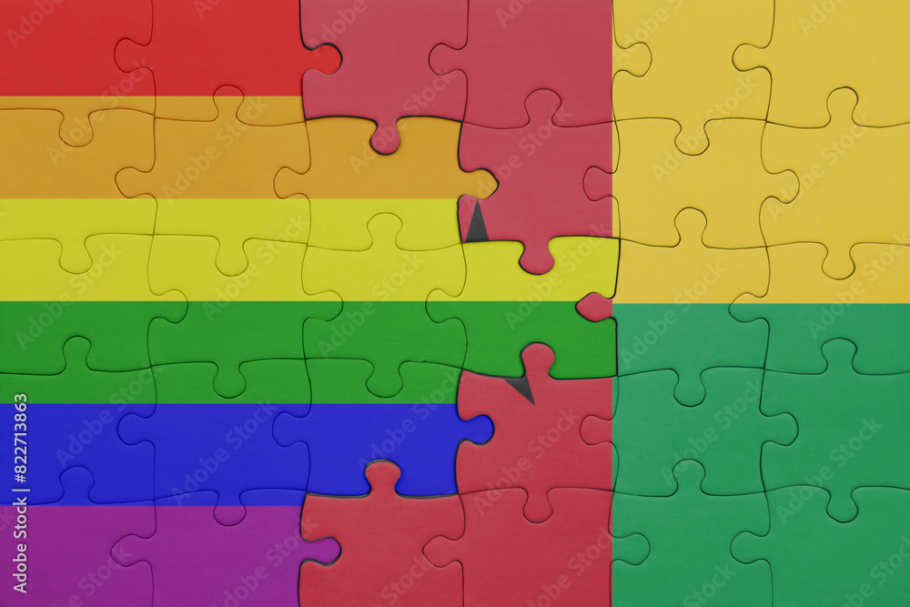 puzzle with the colourful national flag of guinea bissau and rainbow gay pride flag . puzzle with the colourful national flag of guinea bissau and rainbow gay pride flag .