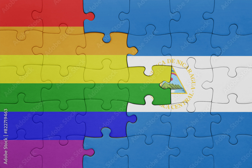 puzzle with the colourful national flag of nicaragua and rainbow gay pride flag . puzzle with the colourful national flag of nicaragua and rainbow gay pride flag .