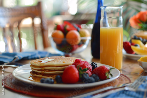 Delicious breakfast spread with pancakes fresh fruits photo