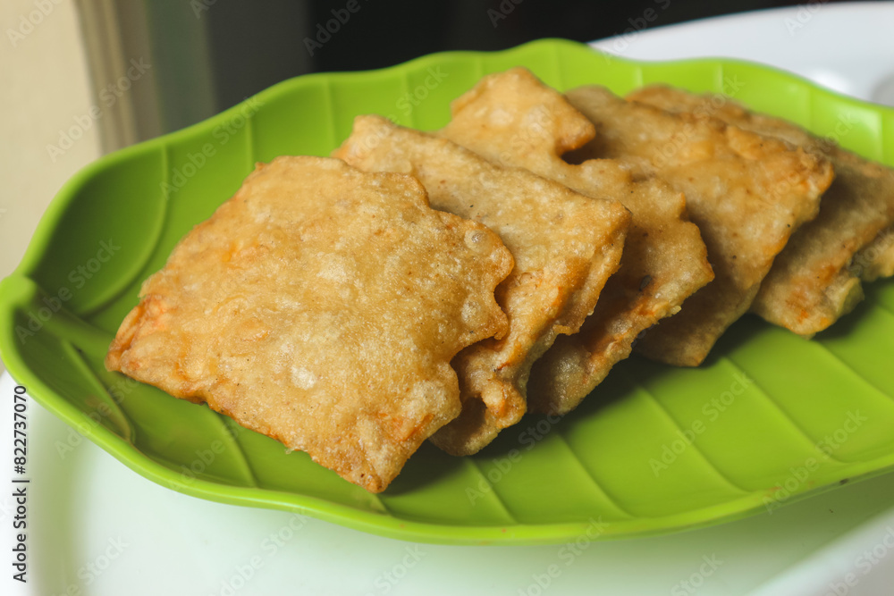Deep fried tempeh or Tempe Mendoan is Indonesian traditional food made from tempeh covered in flour batter.