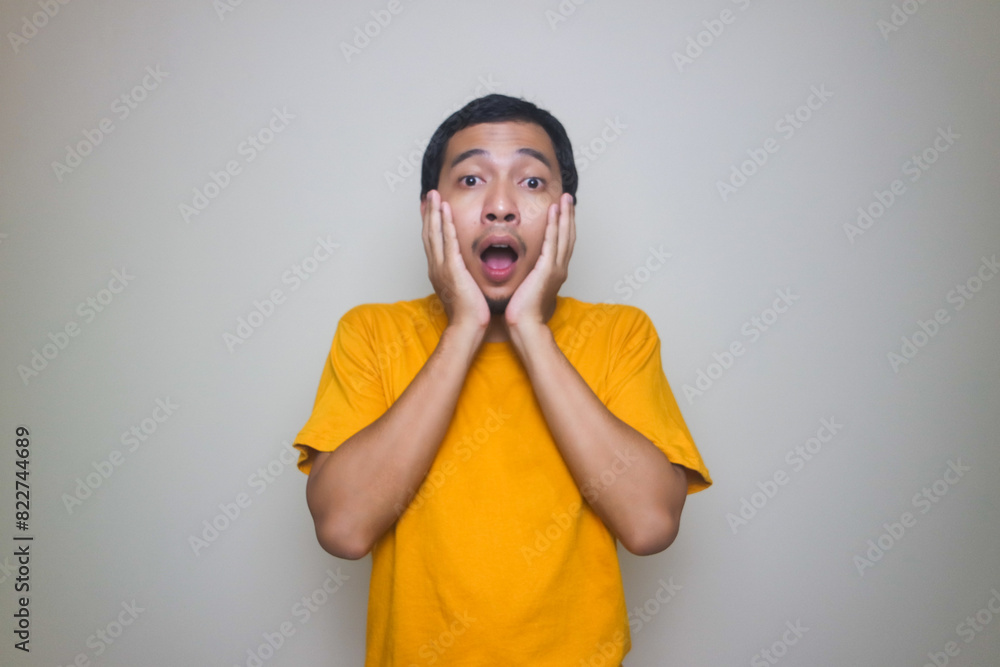 Portrait of young Asian man posing on white background Portrait of young Asian man posing on white background