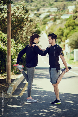 Couple, stretching and workout for exercise in outdoor training as runner for balance growth, marathon or cardio. Sport, man and woman with fitness goals, competition and performance of health start