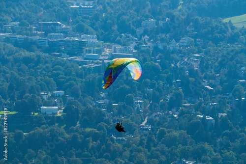 Gleitschirm Flieger mit buntem Schirm über Baden-Baden photo