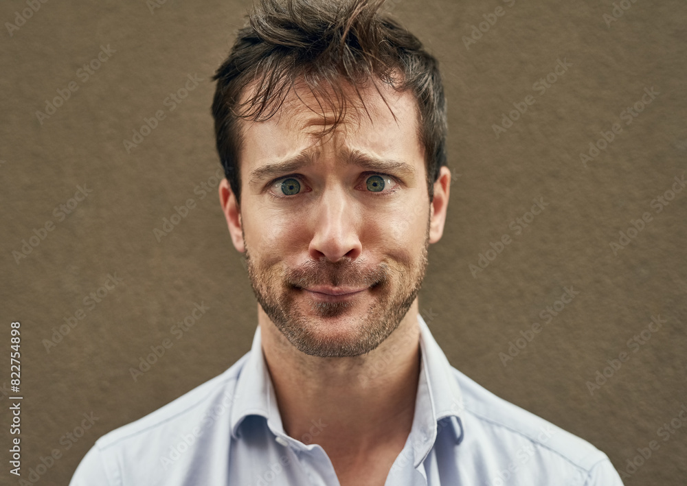 Man, cross eye or funny face on isolated background in silly, goofy or comedy on mockup or wall backdrop. Comic, emoji or happy comedian guy in quirky pose, joke style trend or facial expression Man, cross eye or funny face on isolated background in silly, goofy or comedy on mockup or wall backdrop. Comic, emoji or happy comedian guy in quirky pose, joke style trend or facial expression
