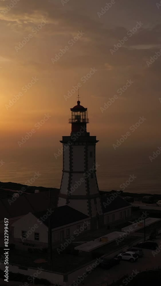 Lighthouse at Cabo Espichel at Sunset. Golden Hour. Portugal. Aerial View. Orbiting. Vertical Video Lighthouse at Cabo Espichel at Sunset. Golden Hour. Portugal. Aerial View. Orbiting. Vertical Video