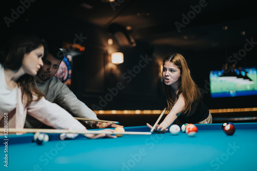 Three young adults focused and enjoying a leisurely game of pool in a dimly lit billiards hall, exemplifying friendship and recreation.
