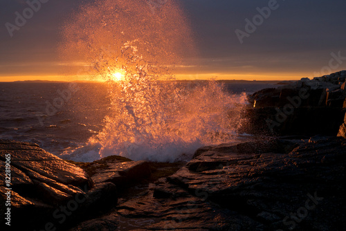 Waves Crashing on Shore Backlit by Sunshine