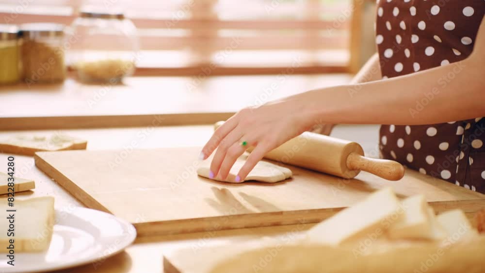 Close up of woman kneaded yeast dough with hand in kitchen at home. Close up of woman kneaded yeast dough with hand in kitchen at home.
