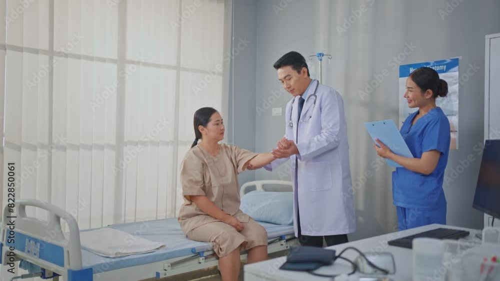 Asian male doctor assist patient woman do physical therapy in hospital. Asian male doctor assist patient woman do physical therapy in hospital.