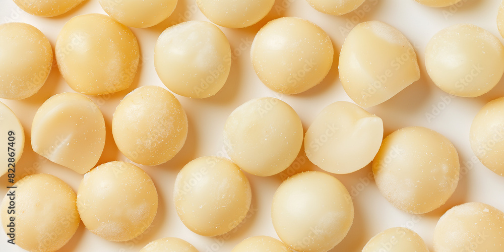 creamy white: a macadamia nuts closeup, a closeup of the macadamia nuts texture, showcasing their smooth and slightly glossy surface with subtle variations in their cream hues creamy white: a macadamia nuts closeup, a closeup of the macadamia nuts texture, showcasing their smooth and slightly glossy surface with subtle variations in their cream hues