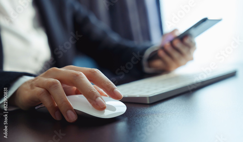 Business manager hand using on white mouse with clicking and its apps for customer support, including email, chat, and communication.