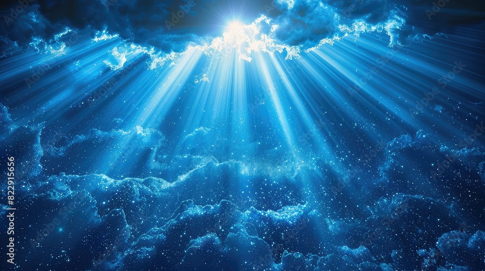 Underwater sun rays shining through the surface of the ocean.