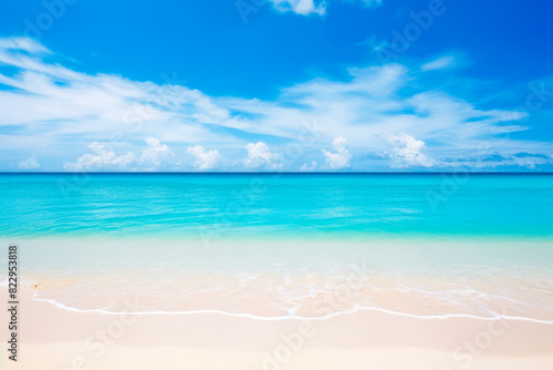 Beach with blue sky and white clouds above it.