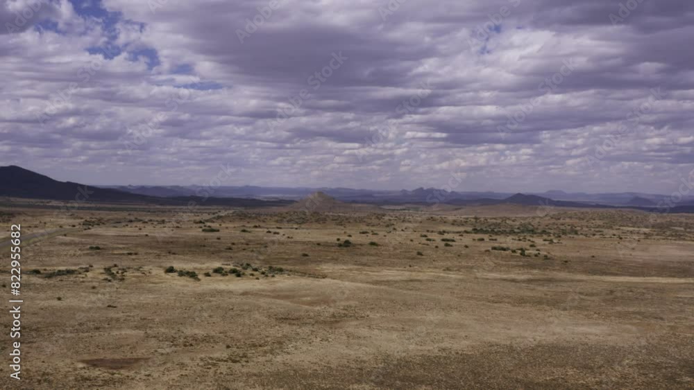 Aerial Karoo cloudy desert landscape, tracking back 4K Aerial Karoo cloudy desert landscape, tracking back 4K