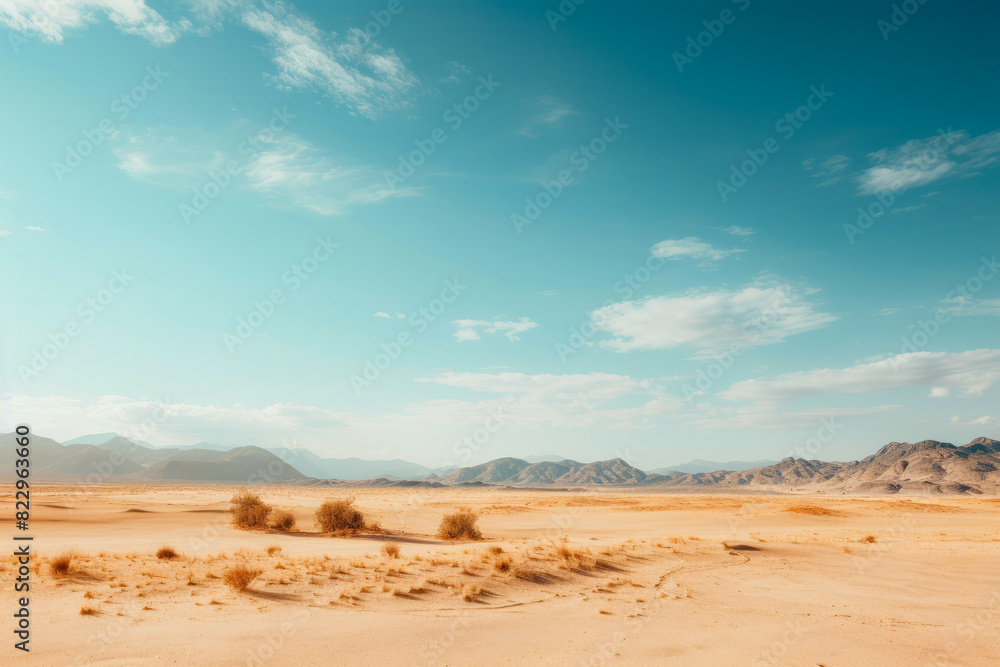 Desert landscape with few bushes and mountains in the distance. Desert landscape with few bushes and mountains in the distance.