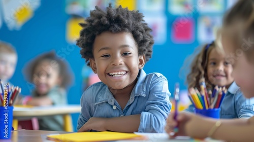 The latest addition to the classroom radiating joy and excitement while displaying their colorful artwork.