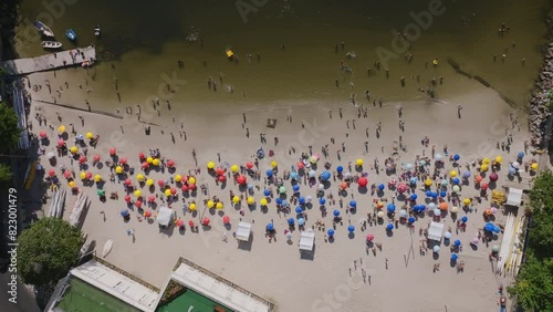Static overhead aerial of Red Beach, Praia Vermelha, with beach goers and swimmers on a hot day in Rio de Janeiro photo