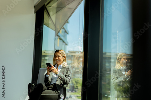 Businesswoman talking on ph...