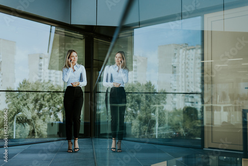 Professional woman standing...
